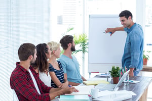 Casual businessman giving a presentation to his colleagues